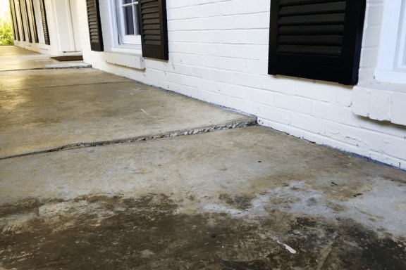 Concrete lifting on patio outside of home