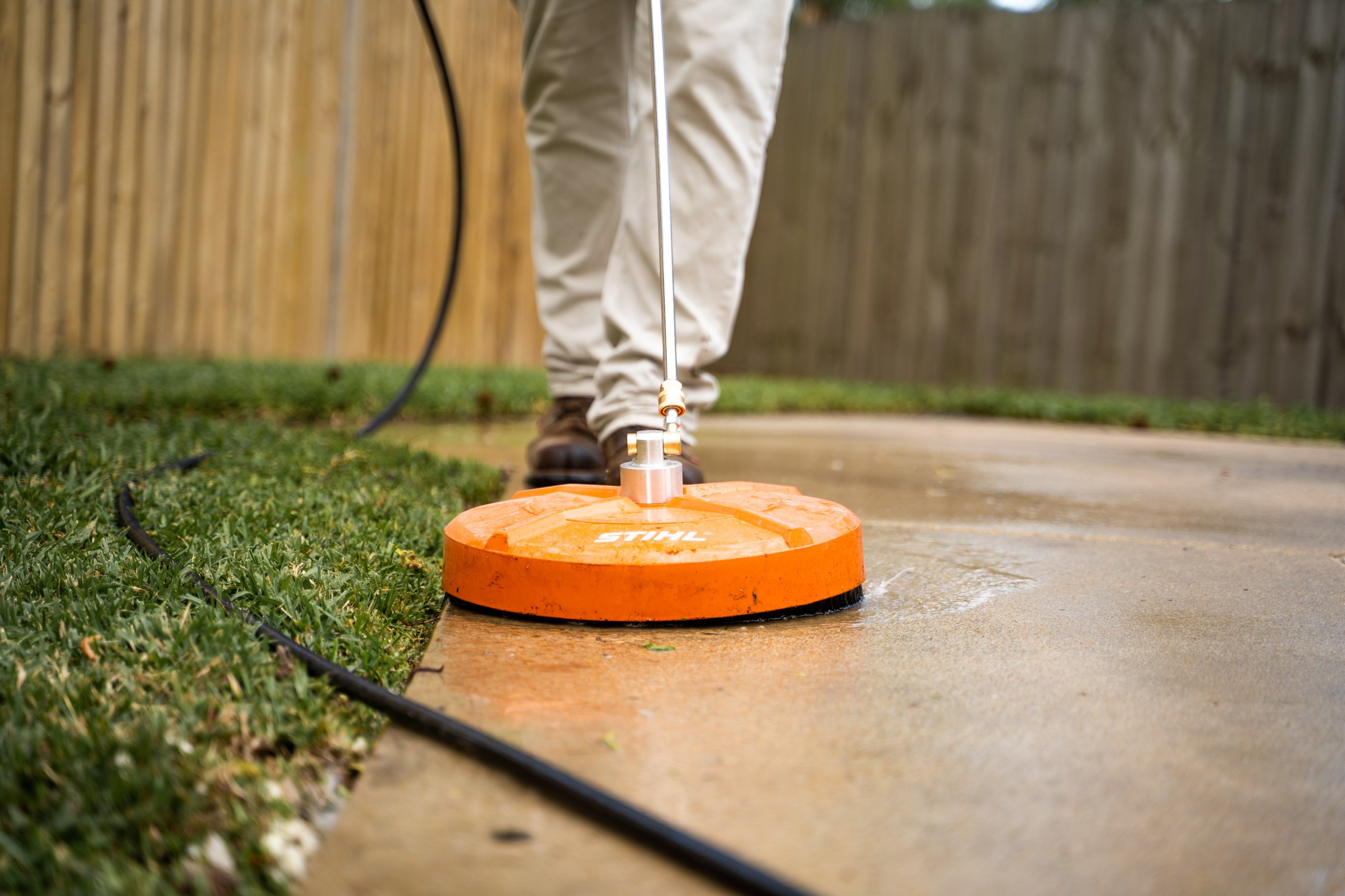 Groundwork tech seals concrete on driveway