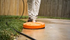 Groundwork tech seals concrete on driveway