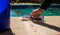 Crack in pool deck concrete being fixed