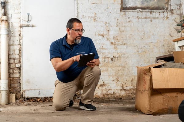 A Groundworks worker inspecting a basement.