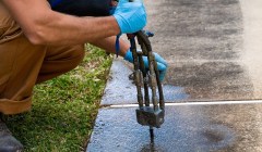 Close up of CFI repairing a concrete sidewalk with Polyrenewal.