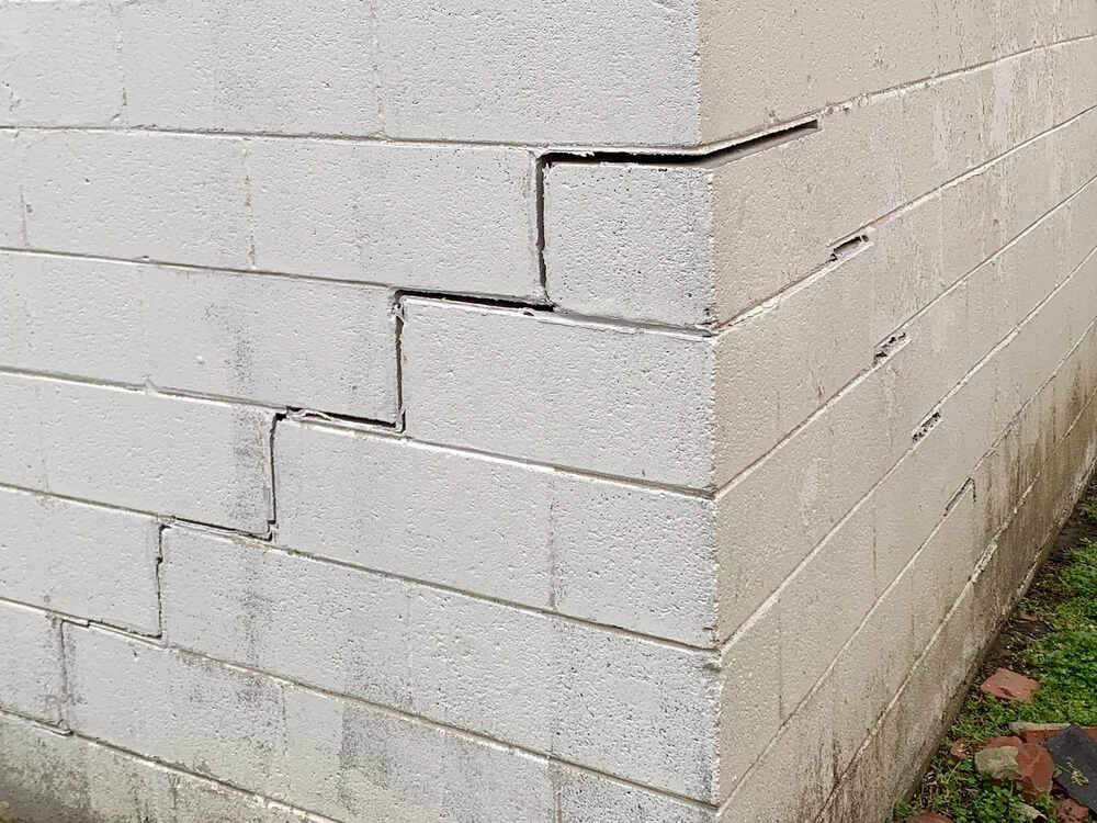 Cracked brick indicating sinking foundation in need of foundation repair