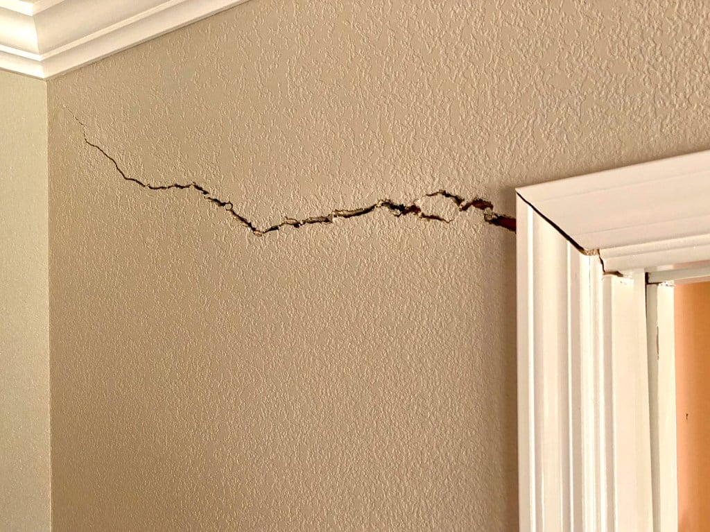 interior wall crack near door frame