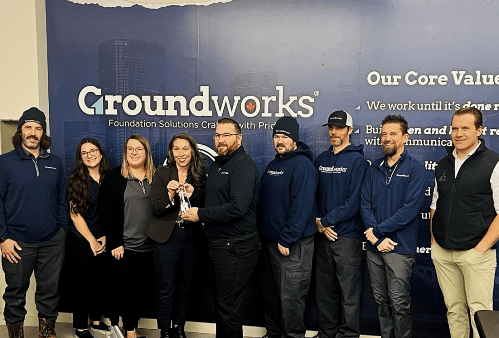 Groundworks Calgary employees receiving the Torch Award from the Better Business Bureau.